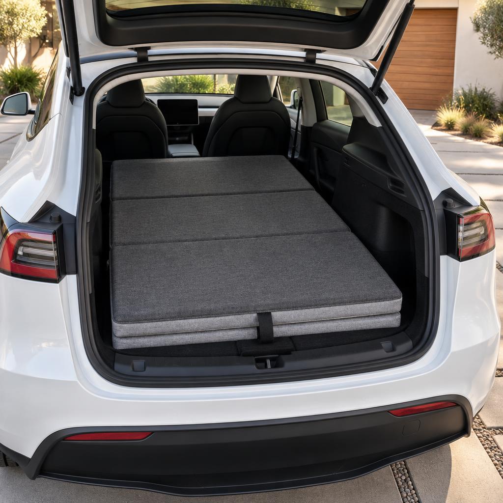 Editorial illustration of a folded foam camping mattress across a Model Y cargo area
